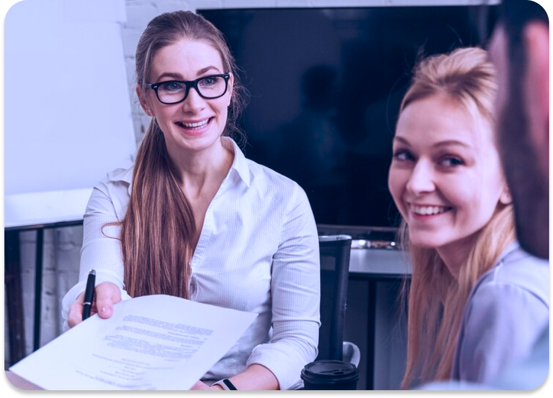 Teammate presenting a results report during a meeting, representing Octopyd’s impact on hiring outcomes